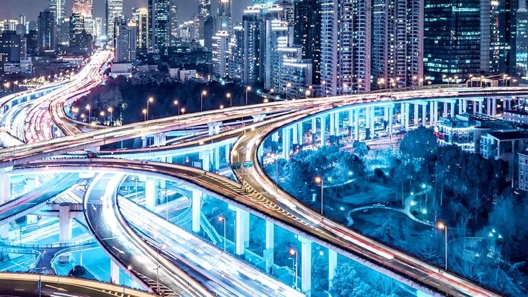 Busy interconnected highways at different levels against sky-scrapers in China