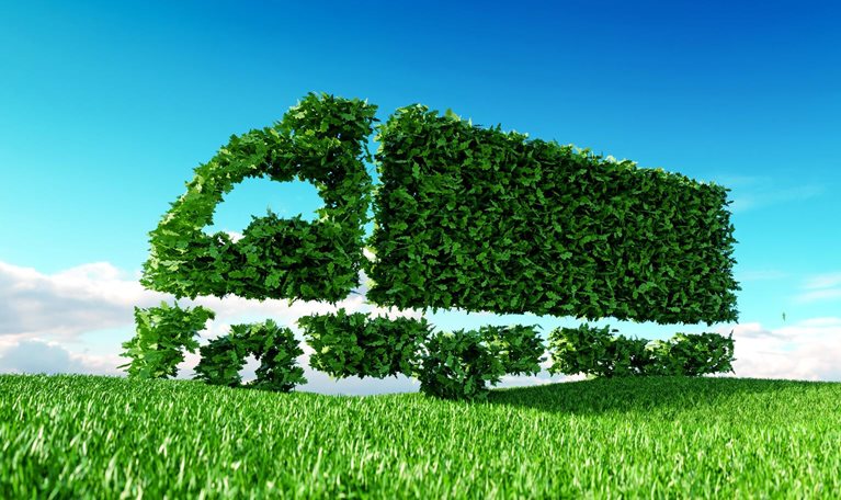 3D rendering of green green truck icon on fresh spring meadow with blue sky in background.