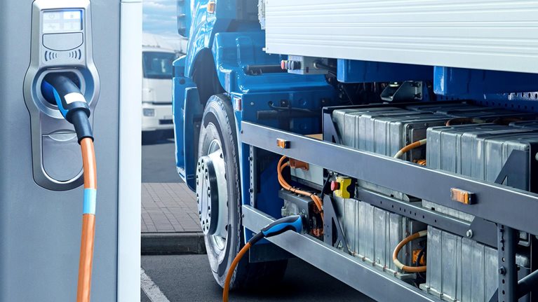 Electric truck with charging station