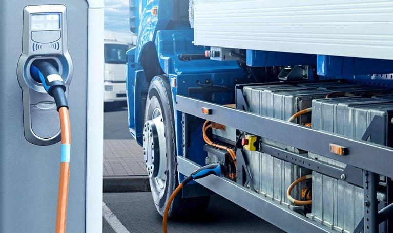 Electric truck with charging station