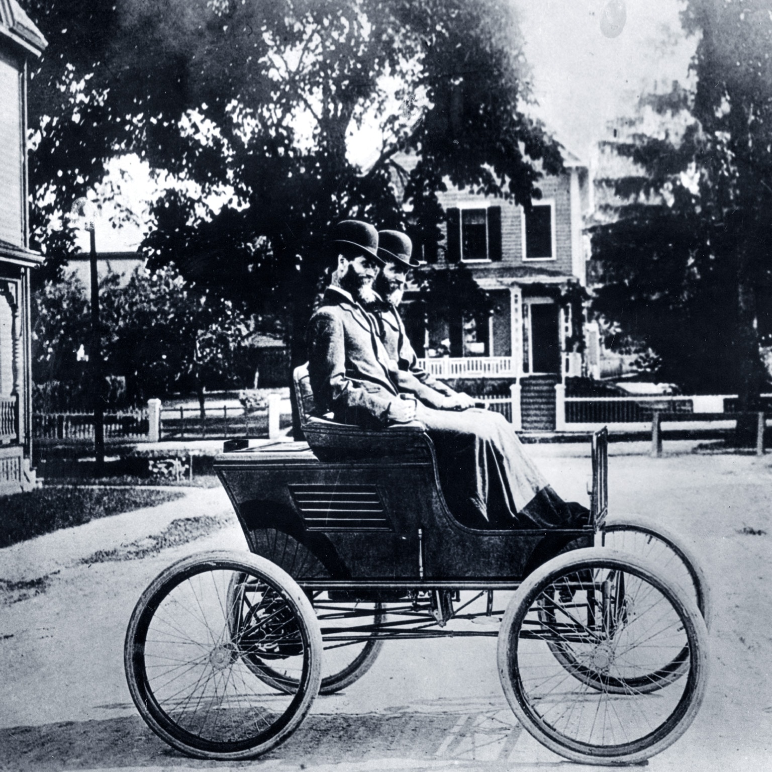 Portrait of twins and automobile manufacturers Freelan (1849-1940) and Francis Stanley (1849-1918) as they pose in their Stanley Steamer car, 1897.