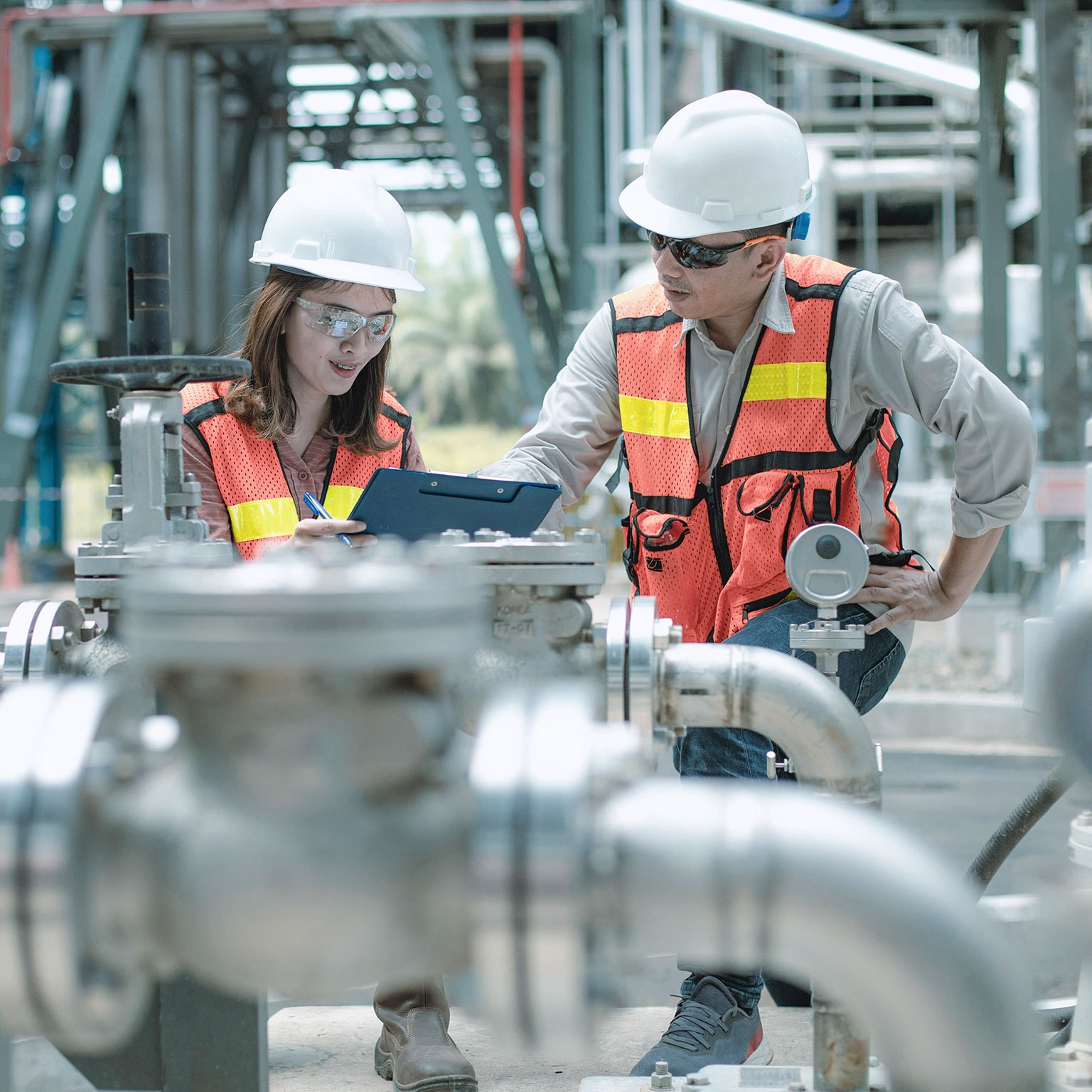 electricity engineer and his supervisor at industrial facility