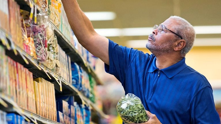 African American man shopping in grocery store