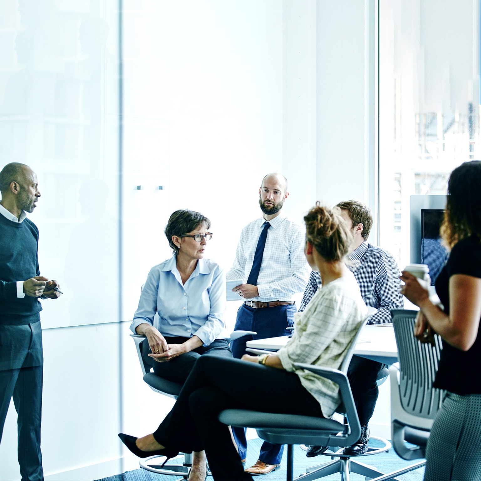 Businesswoman leading team meeting in office