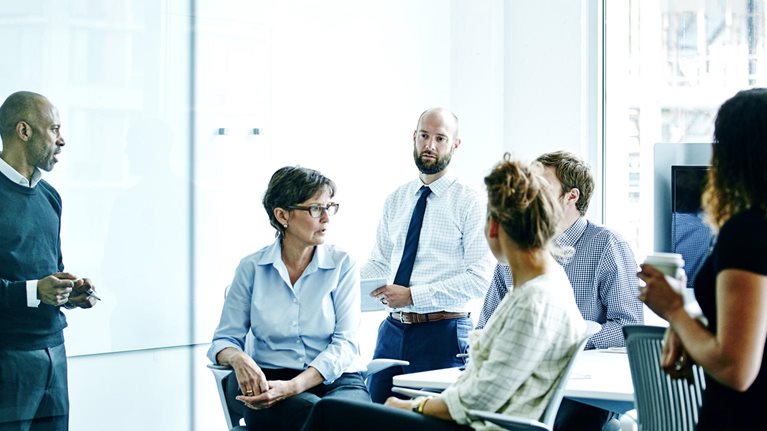 Businesswoman leading team meeting in office