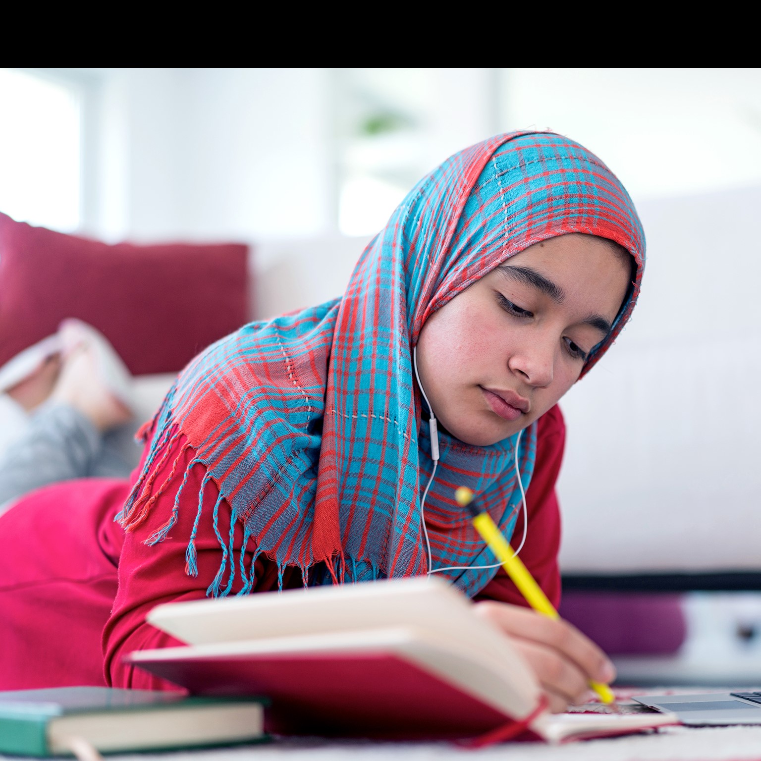 Muslim girl studying at home