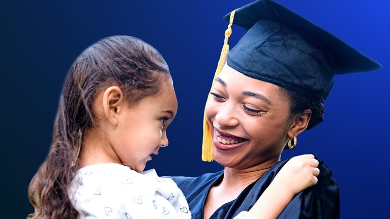 Preschool girl smiles at her mother after the graduation ceremony - stock photo