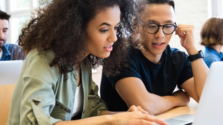 photo students working on laptop