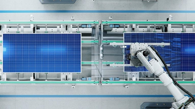 Top View of Solar Panel Assembly Line with Robot Arms at Modern Bright Factory. Solar Panel Production Prodcess at Automated Facility - stock photo