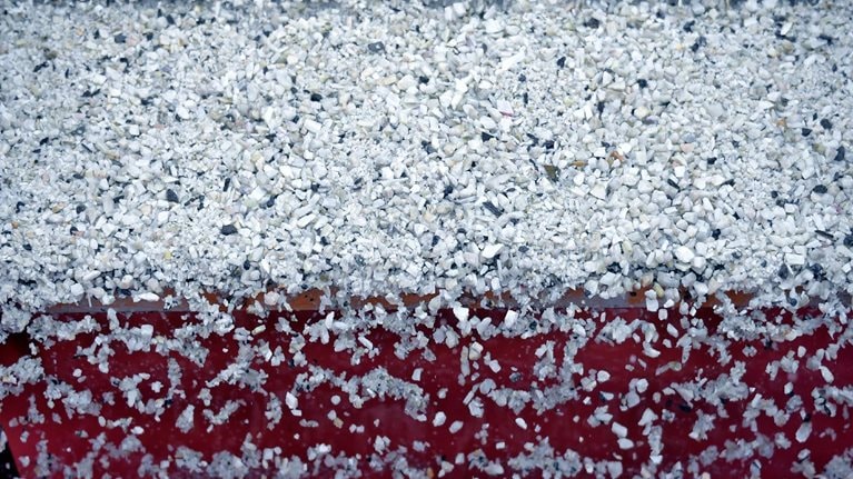 Lithium ore falls through a separation machine