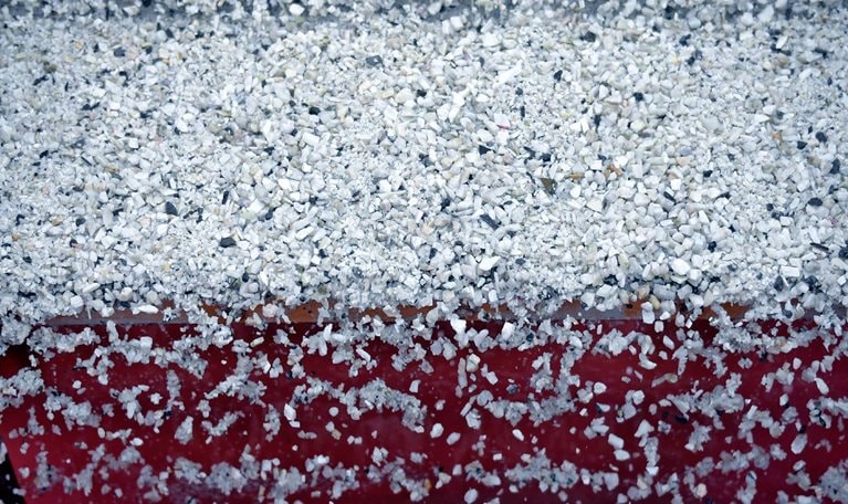 Lithium ore falls through a separation machine