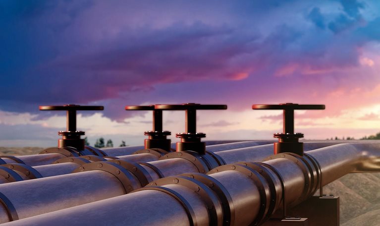 Pipeline Valves at Sunset, Overseeing a Hilly Terrain Under Dramatic Sky