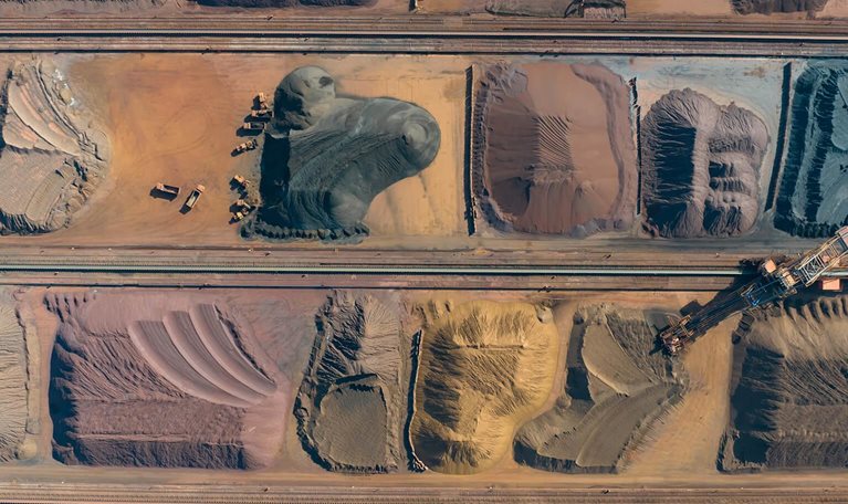 Aerial view of metal raw materials stacked at freight terminal