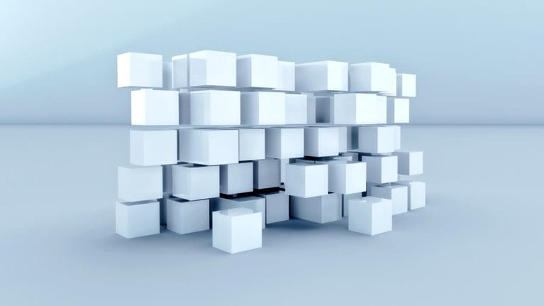 A cluster of semi floating white cubes on a light background