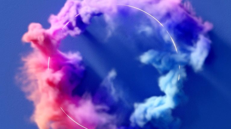 Colorful smoke flowing around a glowing ring