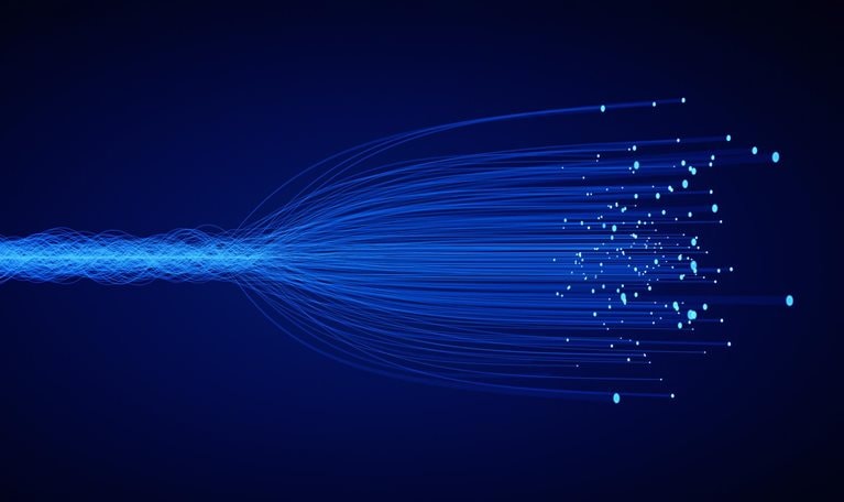 Filaments of light that go from a compact collection to a dispersed array.