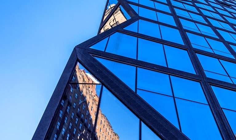Looking up at a hig-hrise residential tower