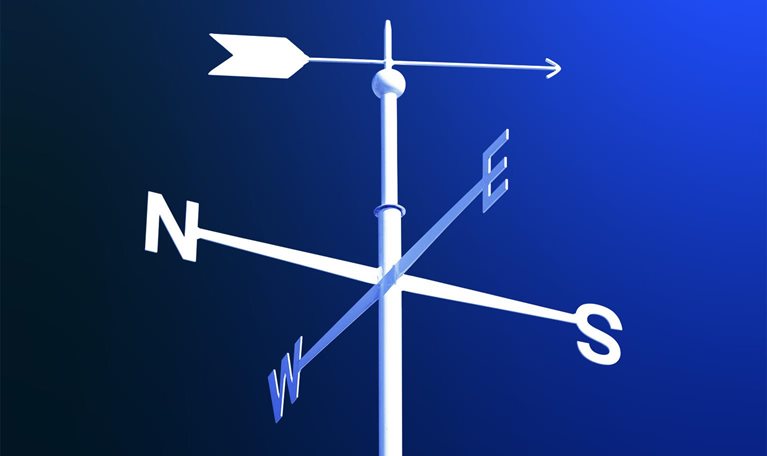 White weathervane on blue gradient background