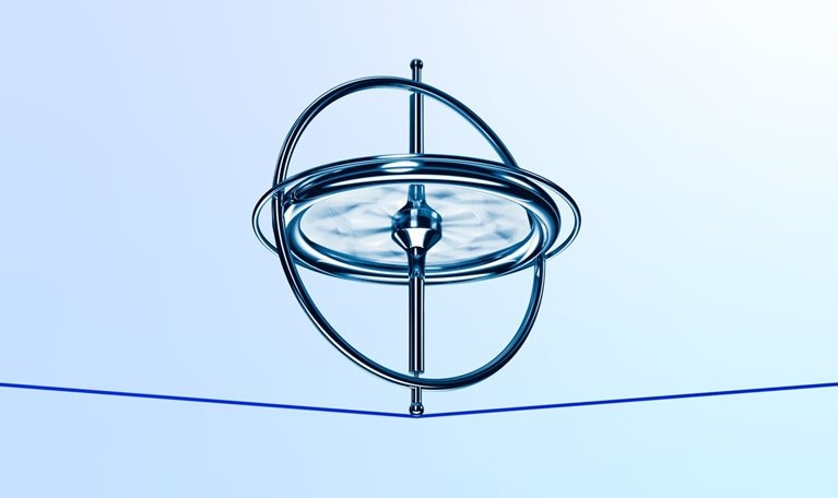 A metallic gyroscope spins on a thin red tread which bends slightly from the weight. The scene is set against a soft blue and white gradient background.