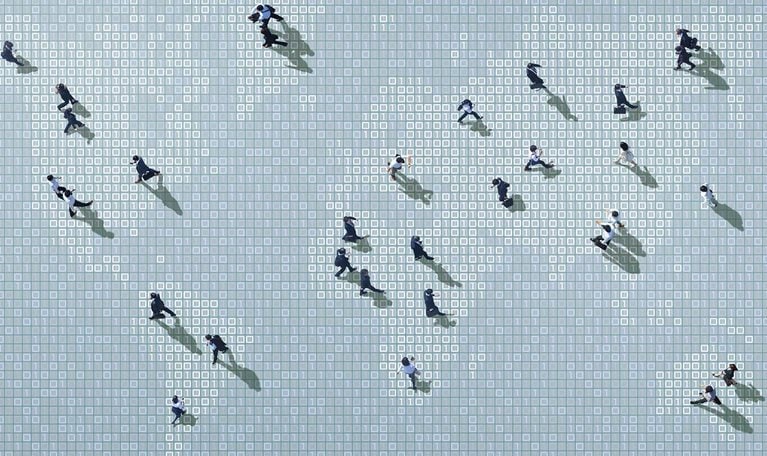 Businessmen walking on binary code world map