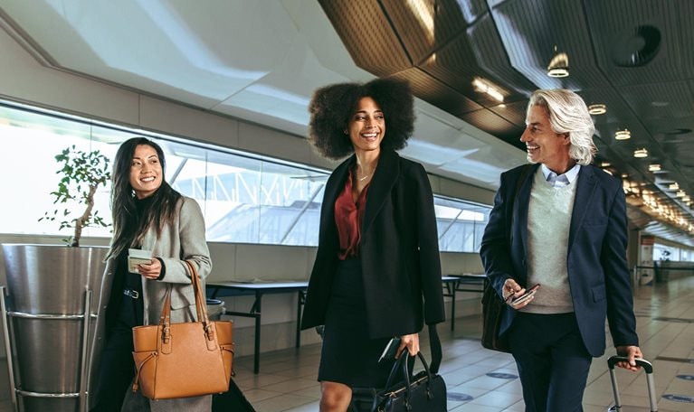 Multi ethnic people going on business trip - stock photo