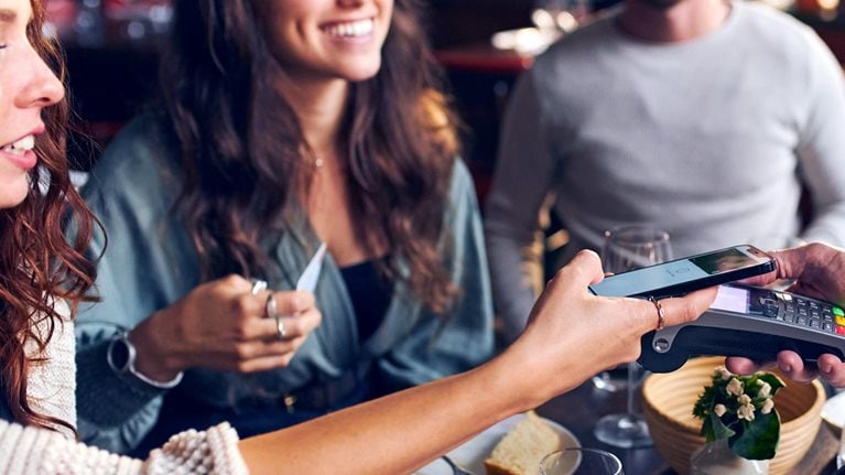Contactless payment with friends at a restaurant