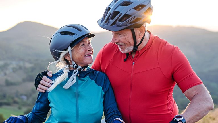 Portrait of senior couple on a bike ride in nature.