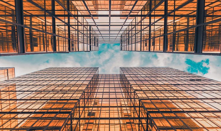 Time lapse Uprisen angle of Hong Kong skyscraper with reflection of clouds among high buildings - stock video