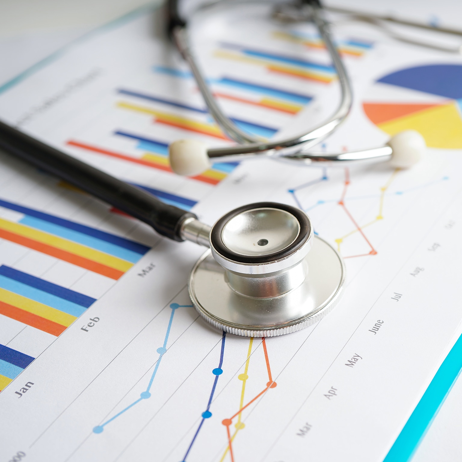 Stethoscope placed on charts of graph paper