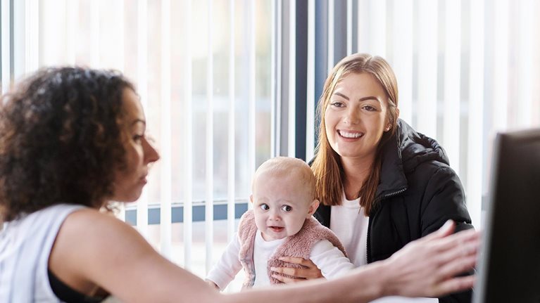 Young mother with social services officer