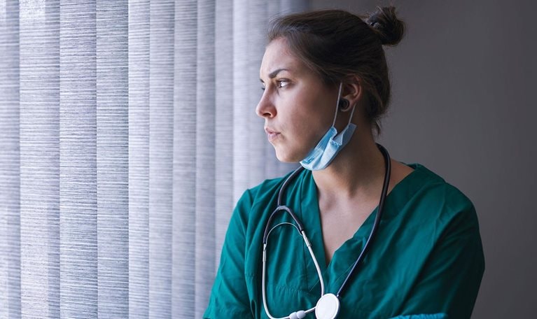 Young female healthcare person tired from the long working day