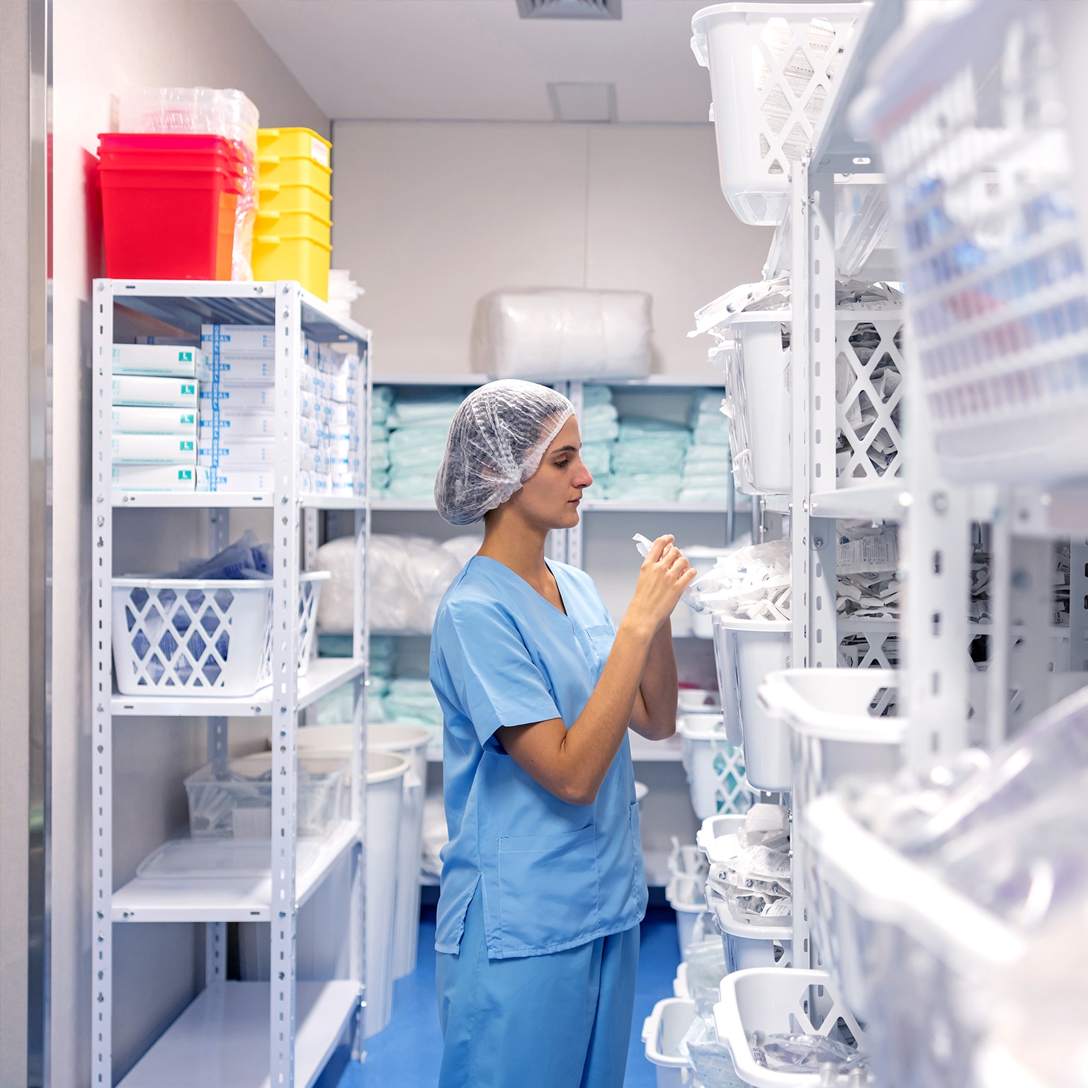 Nurse wearing face mask checking inventory at hospital