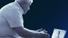 Senior man using laptop.