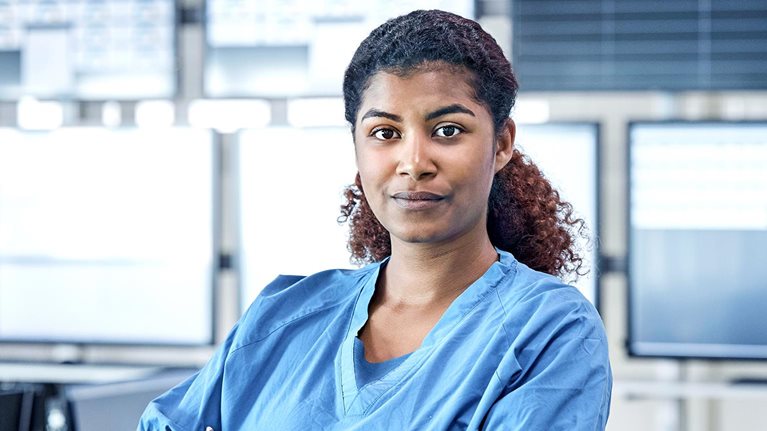 Hospital administrator conducts staff meeting