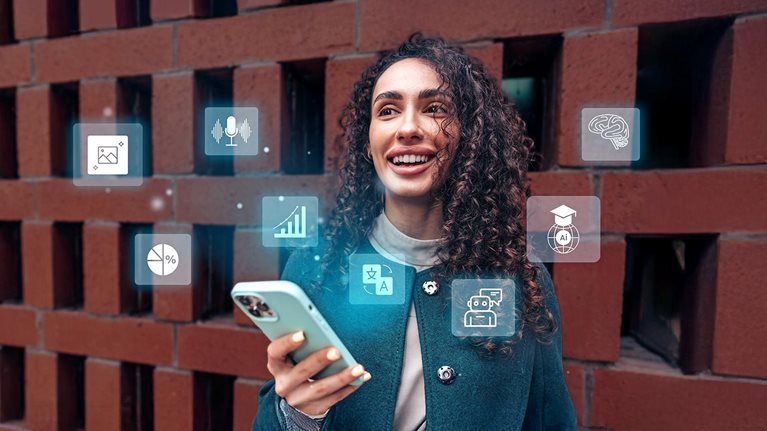 A person smiling while using a smartphone with digital icons hovering around it.