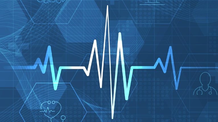 Heart pulse and heartbeat against digital healthcare background.