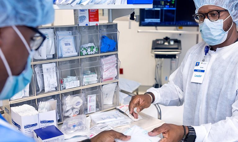 Healthcare professionals organizing medical supplies in clinical setting