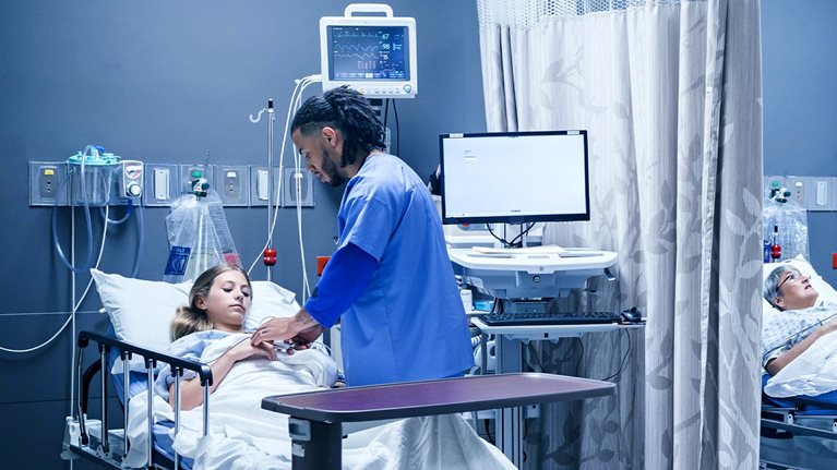 Doctor and nurse with patients in hospital
