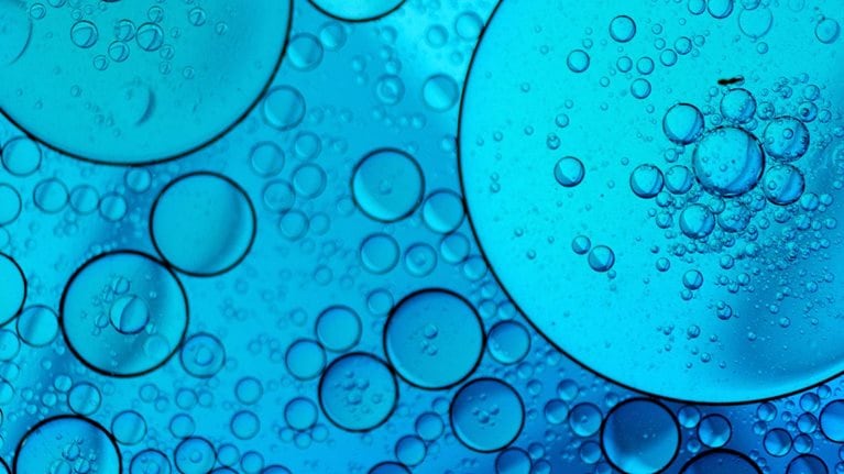 Blue abstract background with oil and water - stock photo