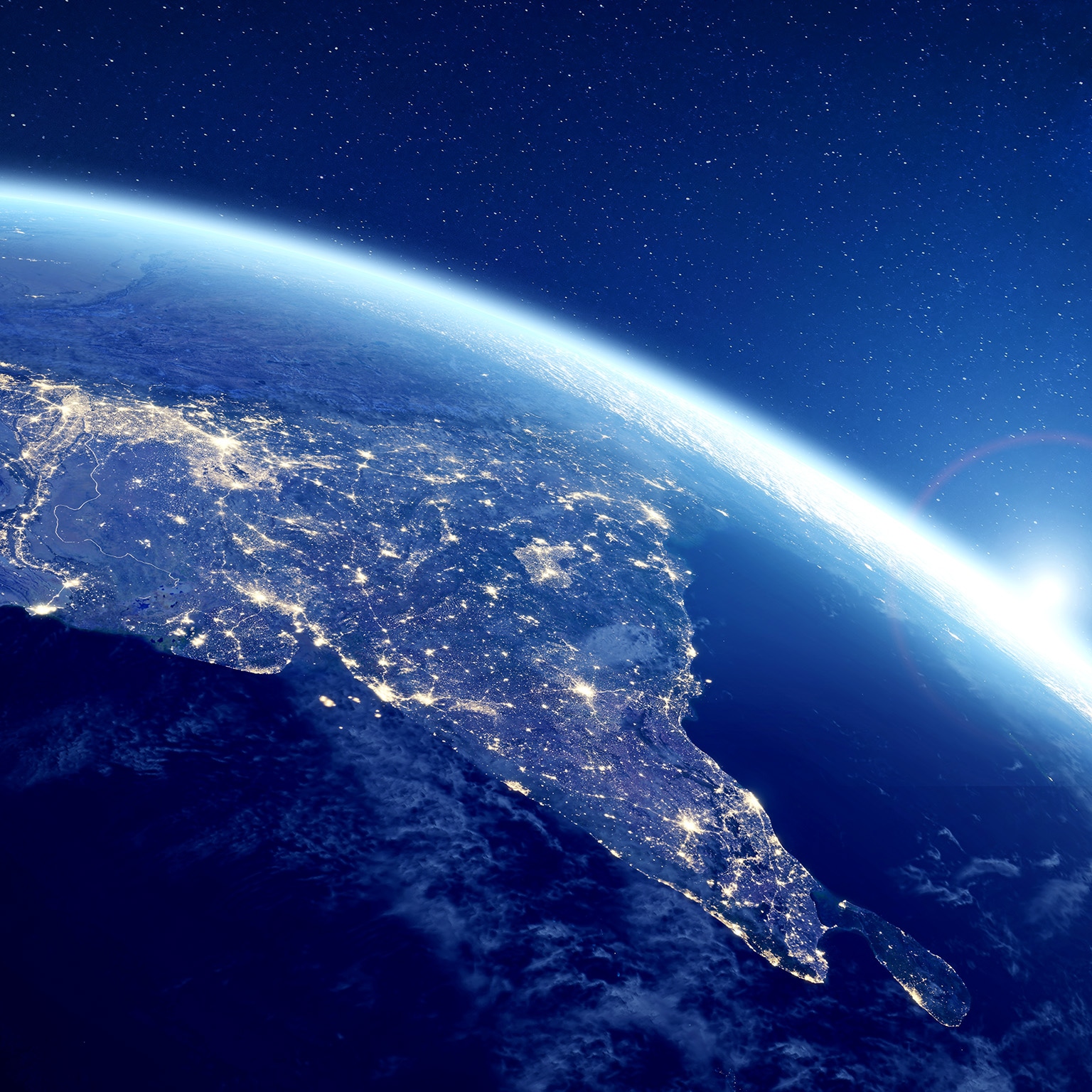 Image of India at night viewed from space with city lights illuminating the country.