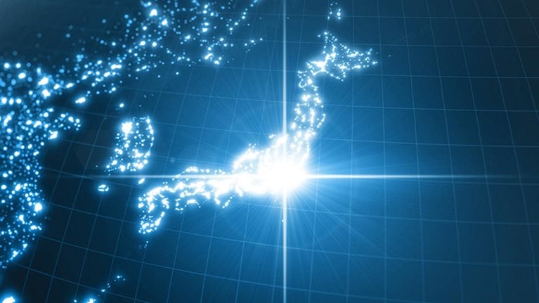 Power of Japan, energy beam on Tokyo. dark globe with illuminated cities and human density areas.