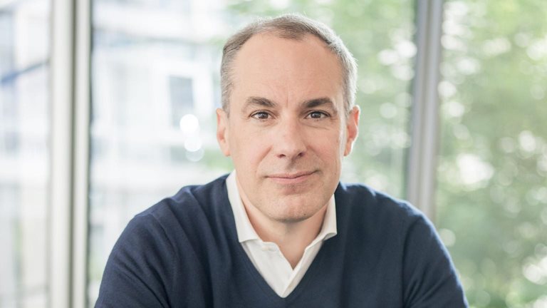 Smiling portrait image of Cedrik Neike