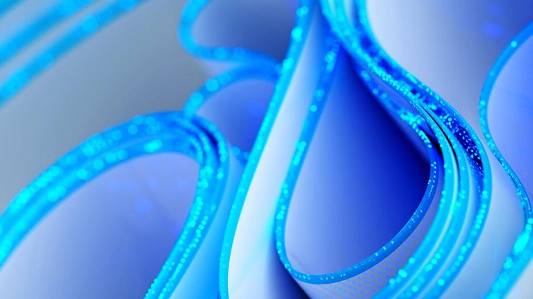 Abstract blue-and-white glowing loops and curved forms, suggesting a futuristic digital network or technology concept.