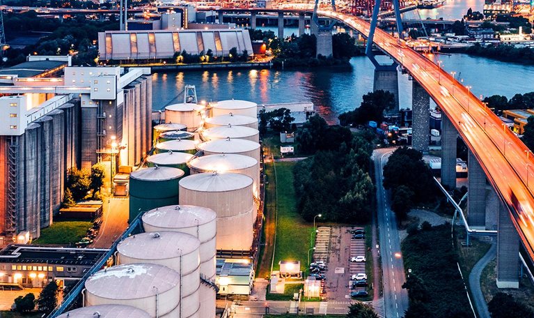 An aerial view of an industrial zone / power station at night