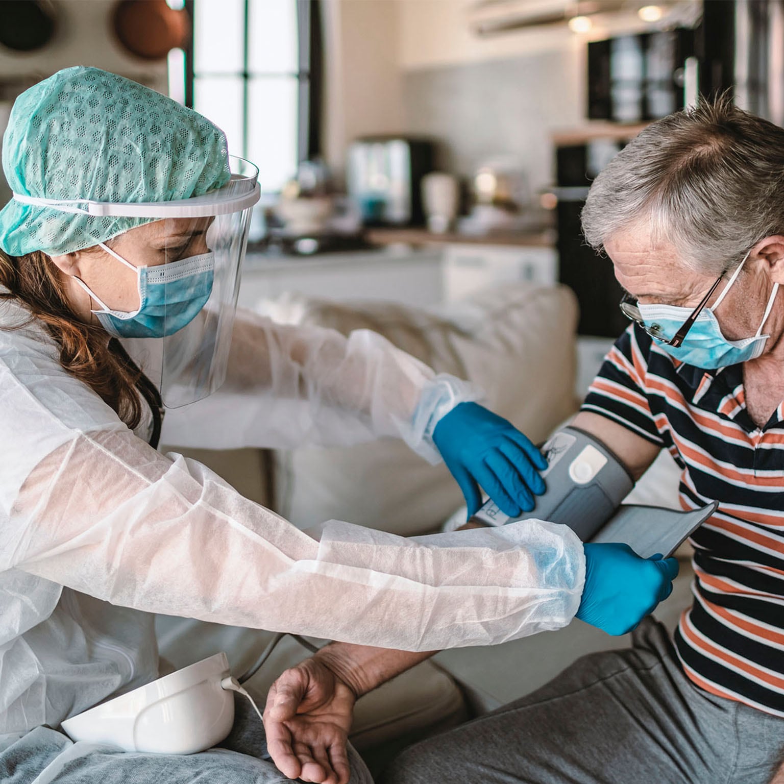 Nurse taking patient's blood pressure