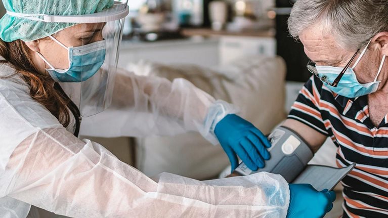 Nurse taking patient's blood pressure