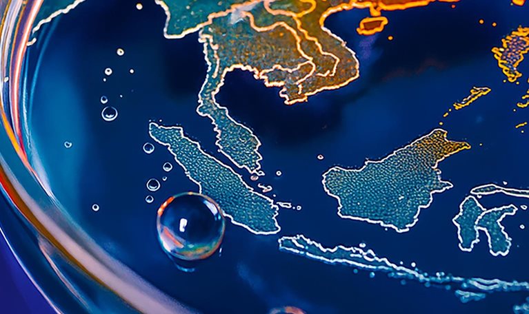 The image is a symbolic representation of climate change, depicting the Earth's landmasses as if in a petri dish with water and bubbles.