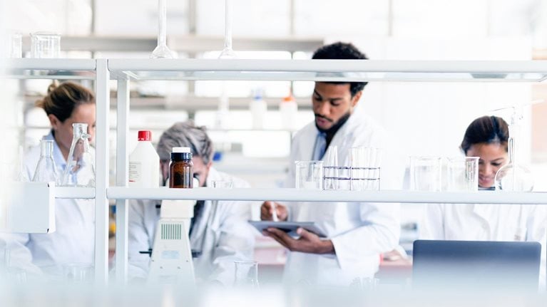 Four scientists working in the laboratory