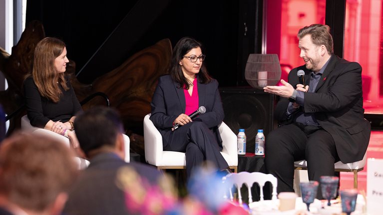 Delphine Zurkiya, Sweta Maniar, and Thomas Fuchs talking together on stage.