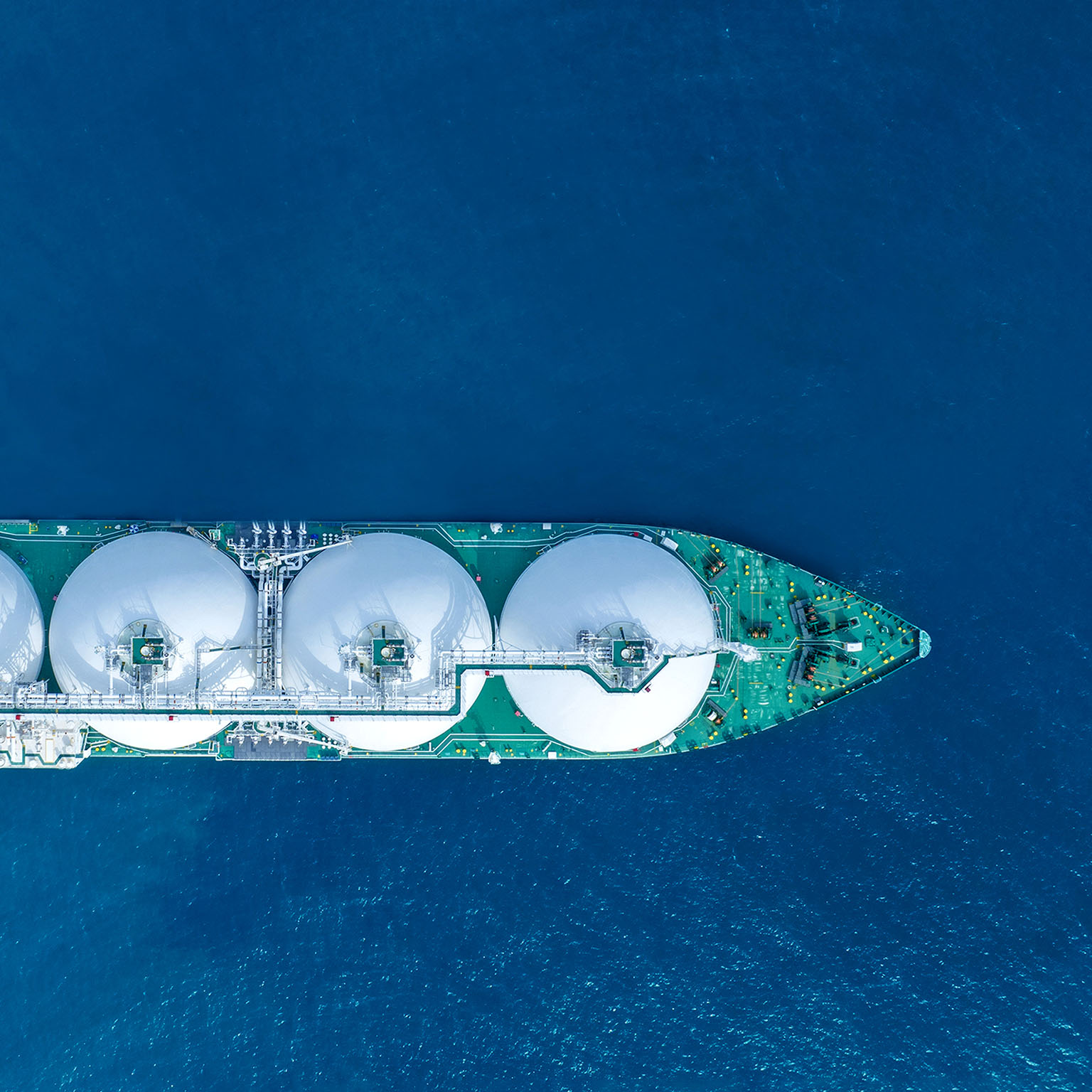 LNG (Liquified Natural Gas) tanker sailing a vast ocean scene